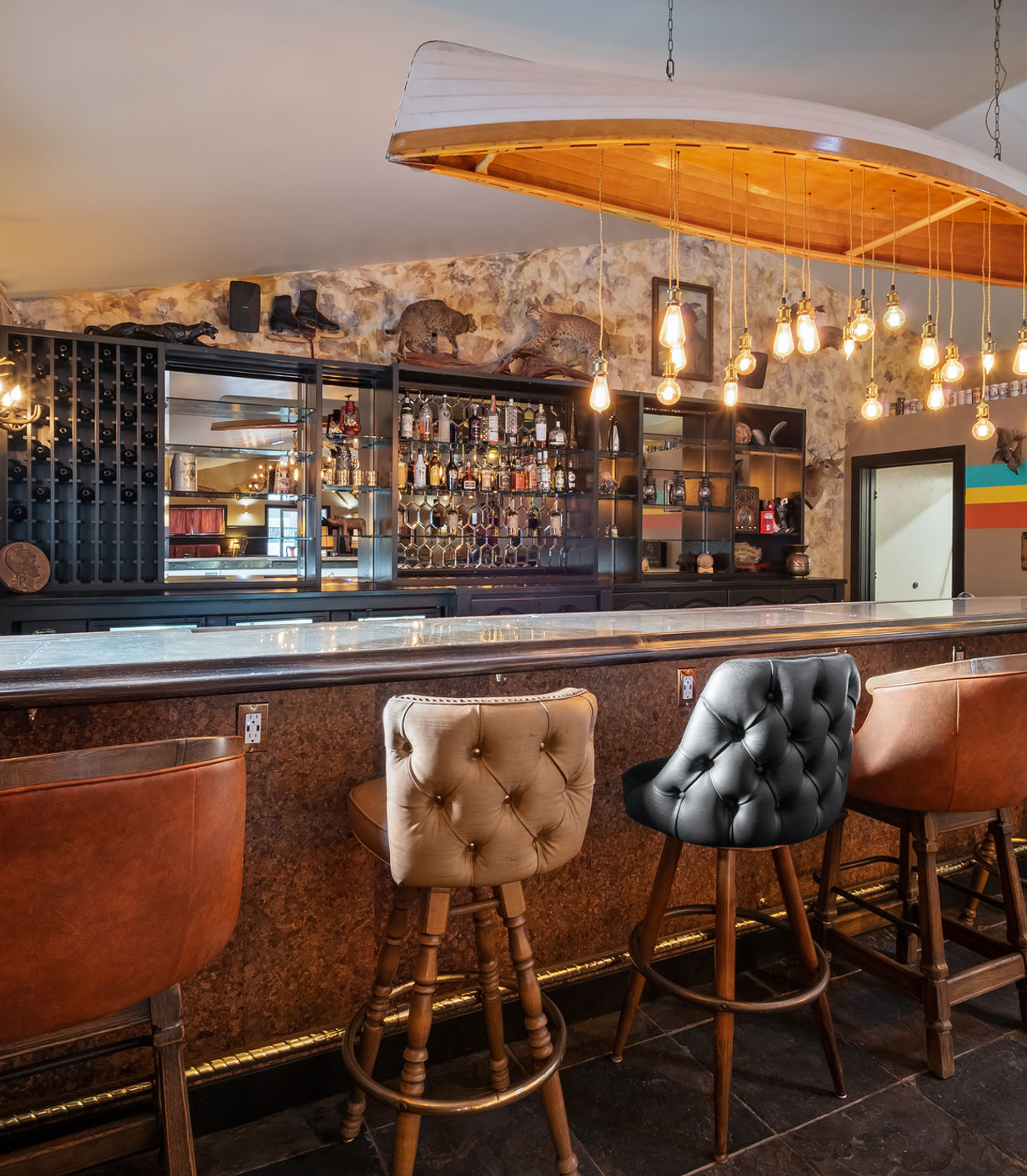 Boutique hotel bar interior with warm lighting and rustic wood finishes